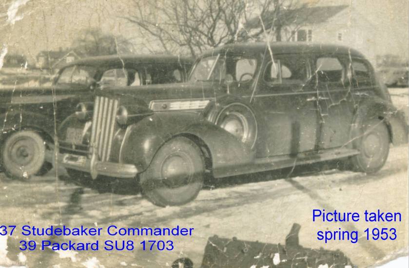 1937 Studebaker behind 1939 Packard super 8