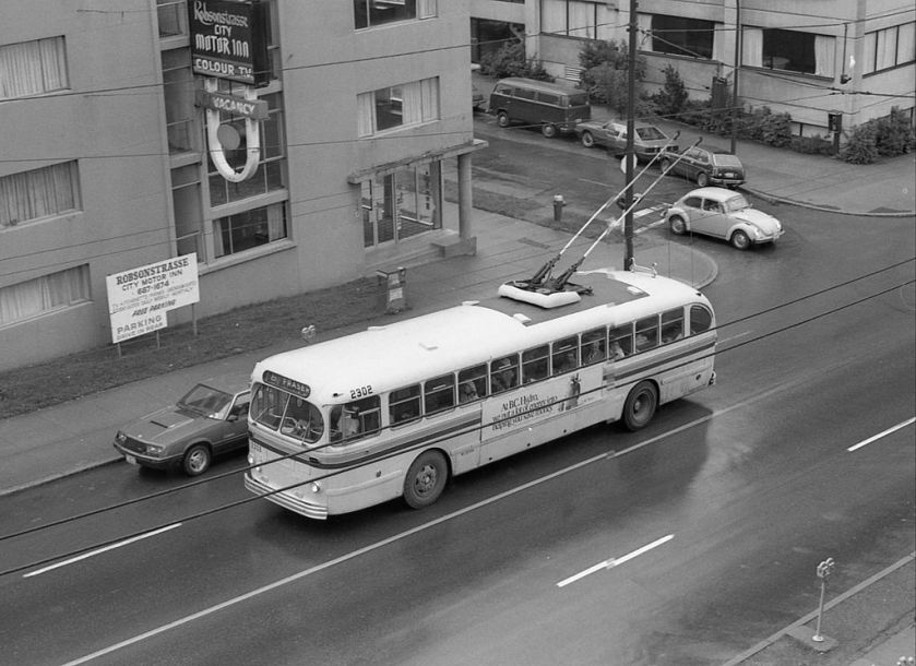 Vancouver_trolleybus_2302_eastbound_on_Robson_Street,_late_1970s