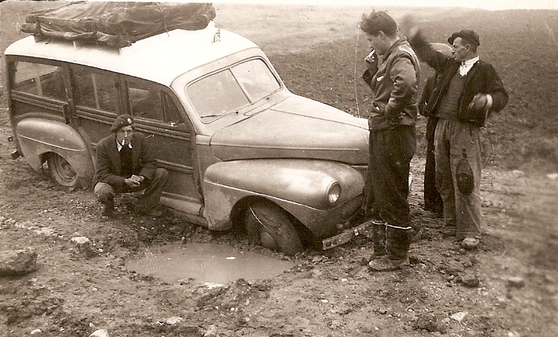 1941 Mercury Eight station wagon - stuck in the mud with race car designer John Crosthwaite (standing)