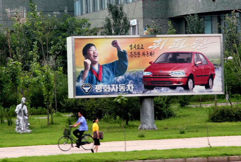Pyonghwa Motors billboard showing the Hwiparam.