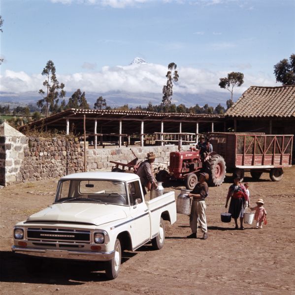 1965 Loading Milk On to International Truck
