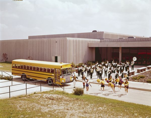 1970 International Bus with Marching Band and Cheerleaders