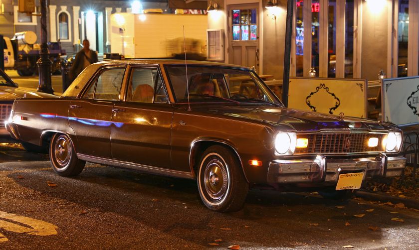 1975 Plymouth Valiant Brougham in brown, by night
