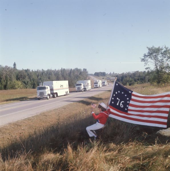 1975 Seven-year-old LuRae Criscione watches the International Harvester United States Armed Forces Bicentennial Caravan