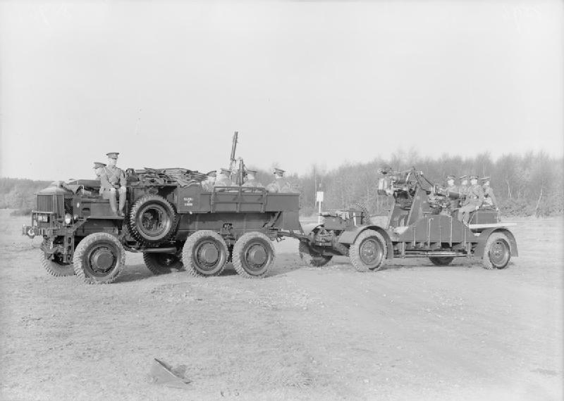 AEC 850 6 x 6 artillery tractor of 15 AA Battery towing a 3-inch AA gun on the cruciform travelling platform.